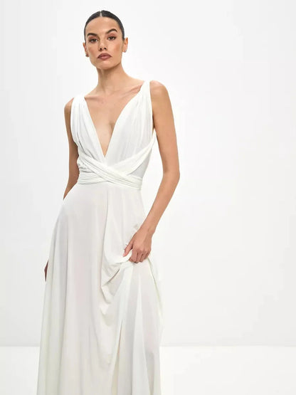 Model wearing the Celeste Wrap Maxi Dress featuring a draped V-neckline and convertible tie detail.