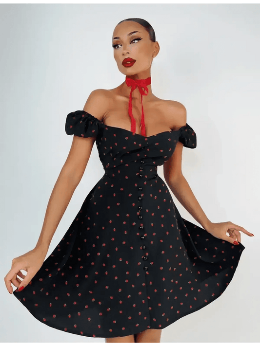 Cherry Kiss Mini Dress featuring cherry print, sweetheart neckline, and puff sleeves, perfect for summer occasions.