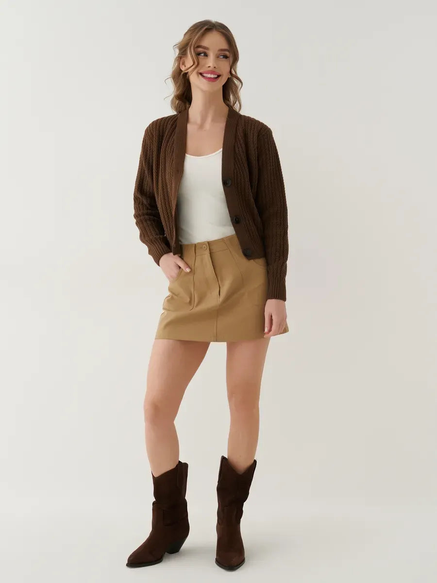 Model wearing a Chestnut Cardigan by Lauven, styled with a cream top and beige skirt, exuding comfort and elegance.