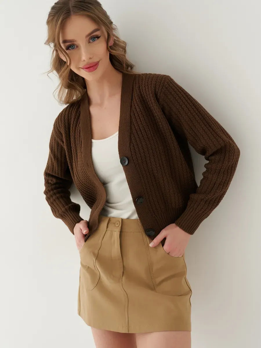 Model wearing the Chestnut Cardigan by Lauven, showcasing its oversized cropped design in warm brown.