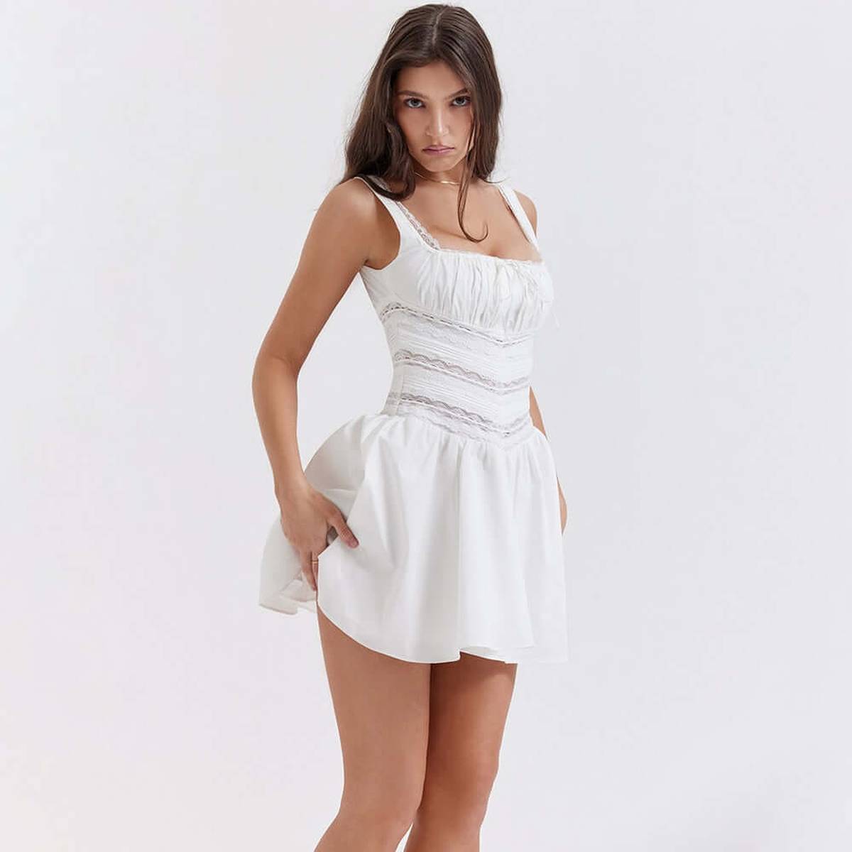 White Clara Mini Dress featuring a fitted bodice and playful skirt, perfect for summer weddings or casual outings.