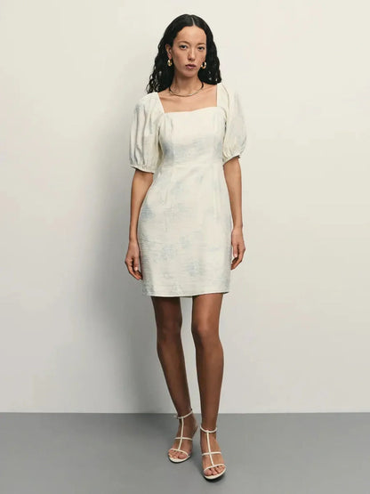 Elegant Cloud Bloom white mini dress with puff sleeves and square neckline, featuring a delicate floral pattern.