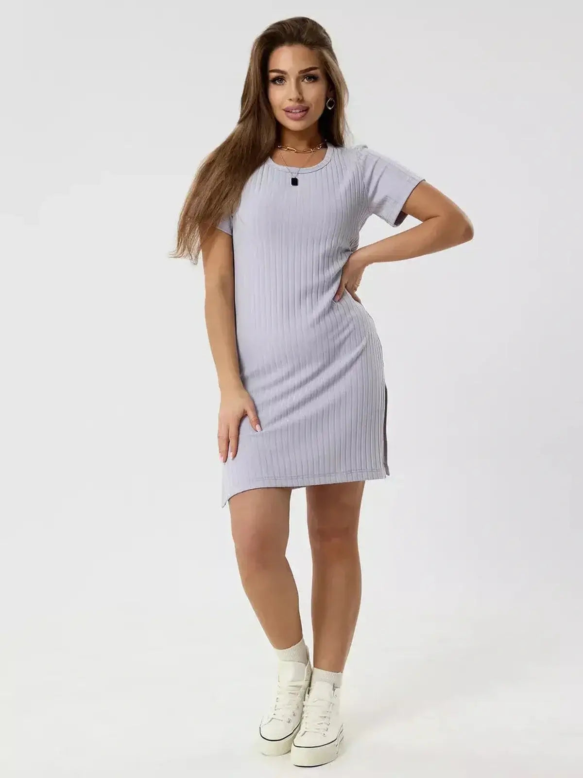 Model showcasing the Cloudline Mini by Lauven, a ribbed summer dress in light purple with short sleeves.
