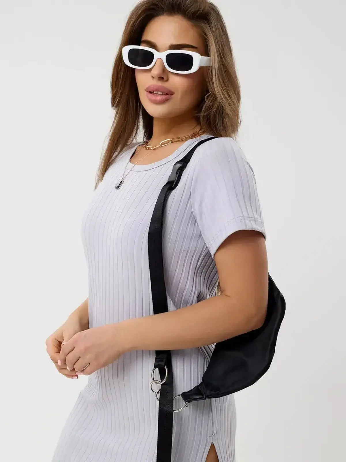 Cloudline Mini dress by Lauven, featuring a ribbed design and paired with a stylish black bag and trendy sunglasses.