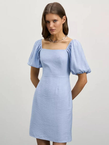 Cloudline Mini dress in light blue with square neckline and puff sleeves, perfect for warm-weather elegance.