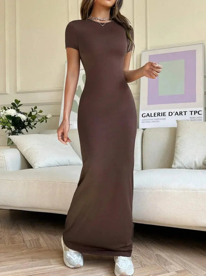 Cocoa Curve Maxi Dress showcasing sleek fit with back slit and asymmetric neckline, styled for elegance and comfort.