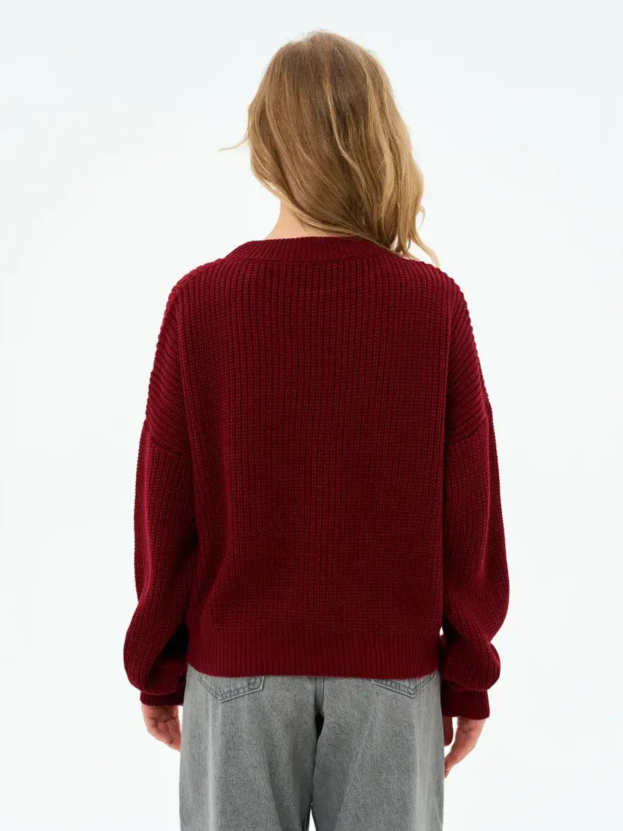 Back view of the Crimson Charm Sweater by Lauven, showcasing its oversized knit in deep burgundy.