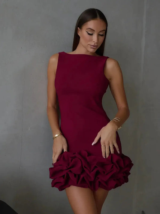Sleek sleeveless burgundy mini dress with a ruffled hem, perfect for weddings, parties, or formal occasions.