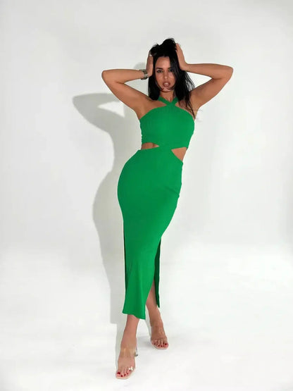 Model wearing a green crisscross glow midi dress featuring sleek cutouts and a modern halter neckline.