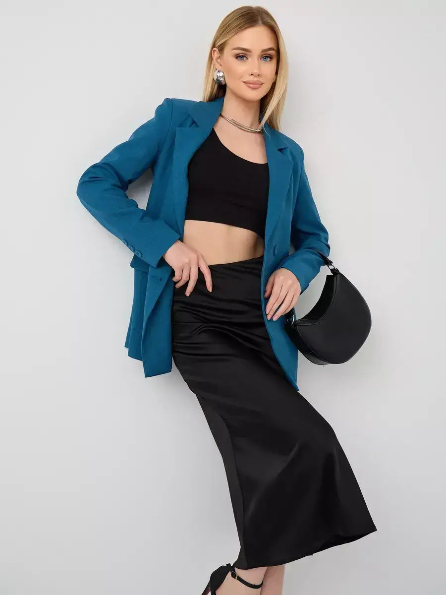 Diana Blazer by Lauven, showcasing a stylish cropped teal blazer worn with a black crop top and satin skirt.