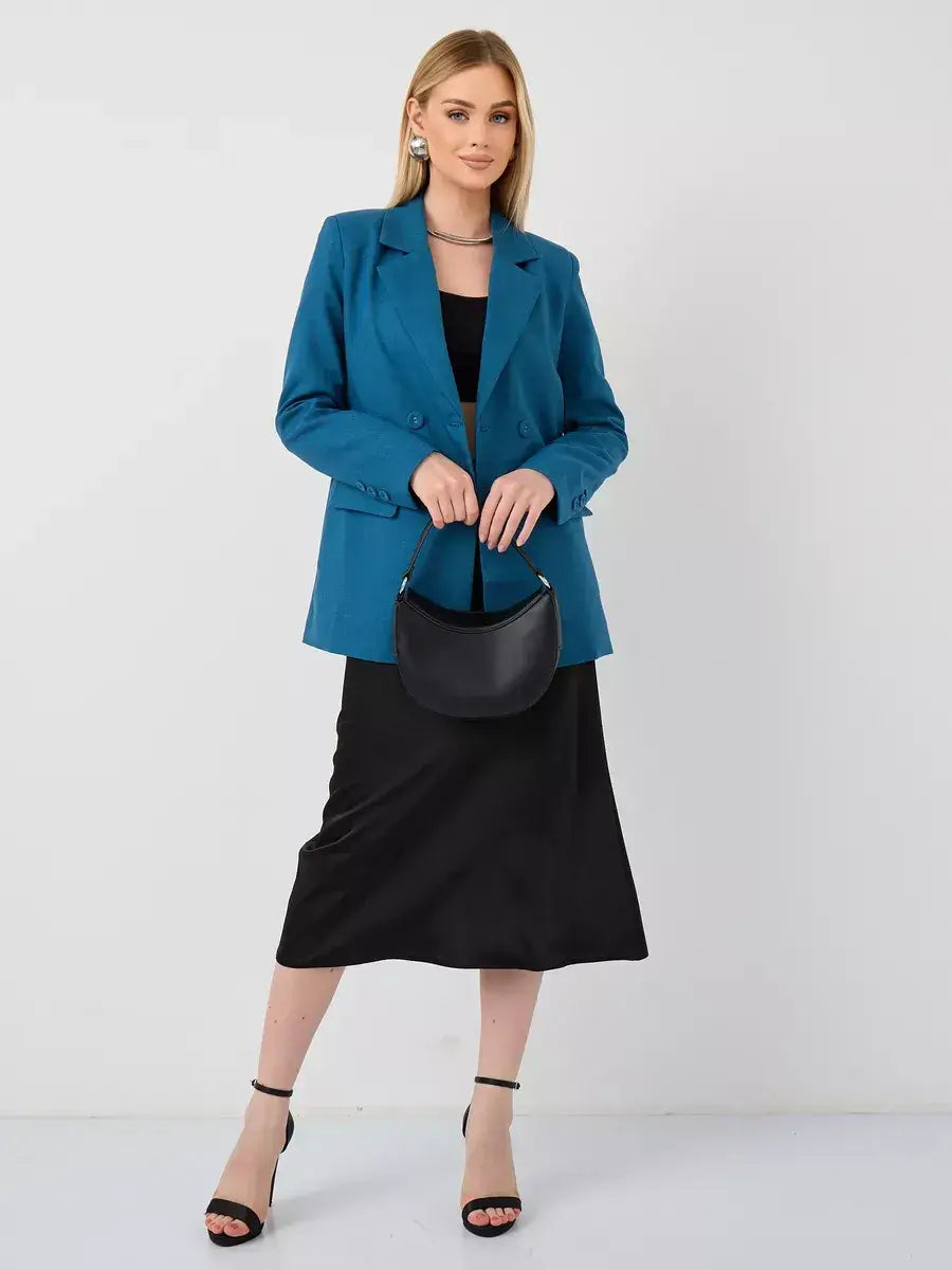 Model wearing Lauven Diana Blazer in blue over a black dress, showcasing elegant and versatile styling.