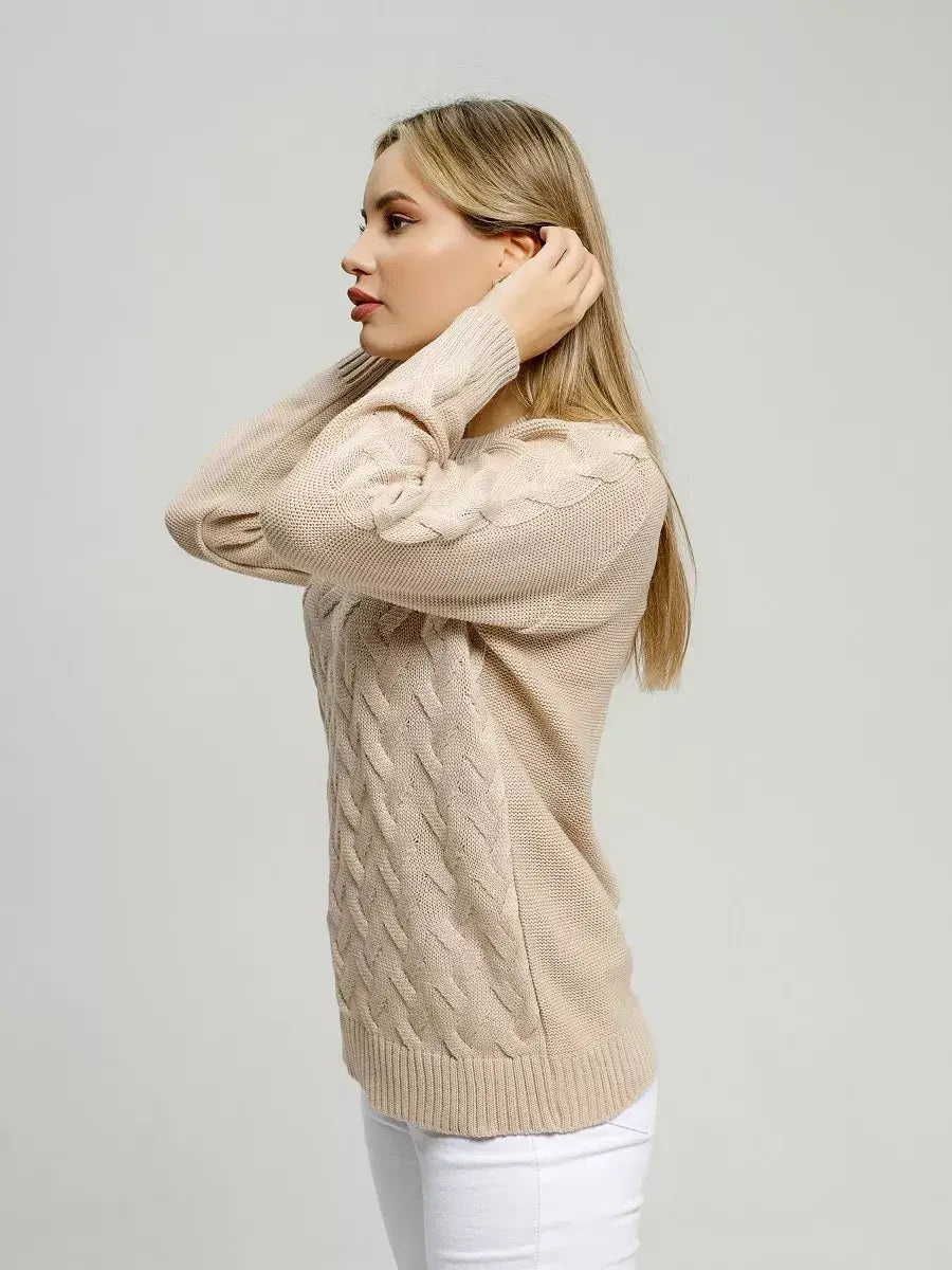 Model showcasing Elara Sweater by Lauven in soft light beige knitwear, emphasizing breathable comfort and refined style.