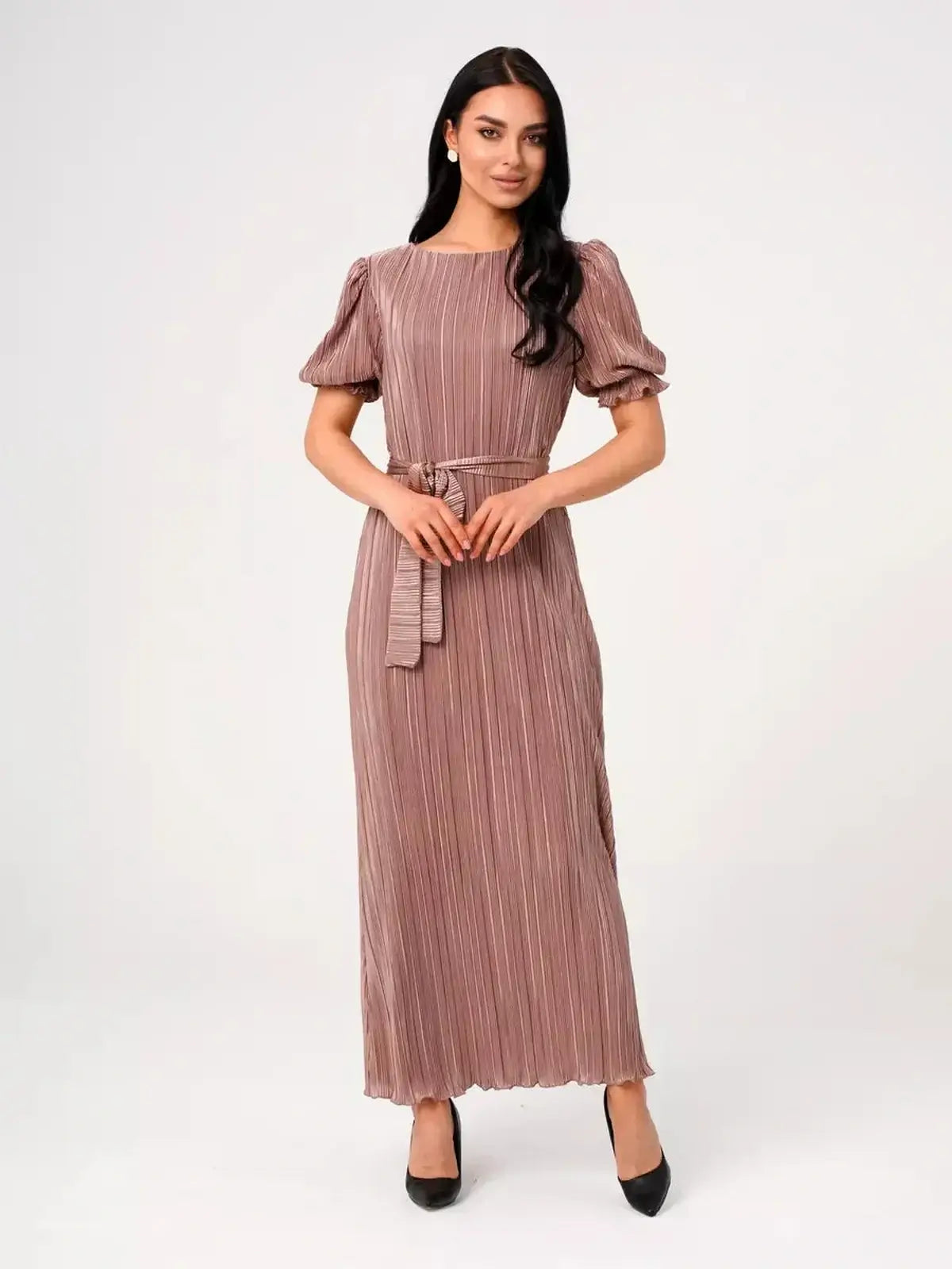 Light cappuccino Celeste Maxi Dress featuring elegant pleats, puff sleeves, and a flattering longline silhouette.