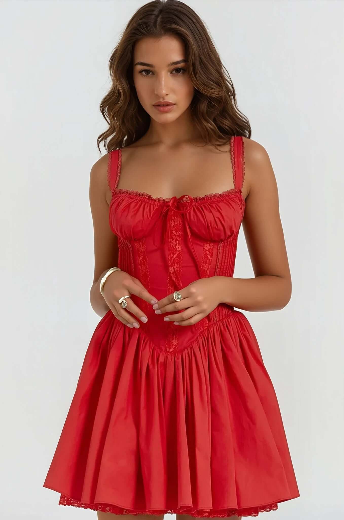 Model wearing a red Opal Mini Dress, featuring a fitted bodice and flowing skirt, ideal for summer or cocktail occasions.