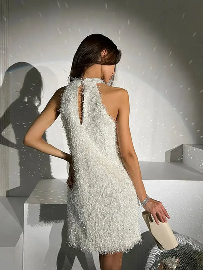 Stylish back view of a white Pearl Halo mini dress with textured fringe, perfect for summer parties or wedding guests.