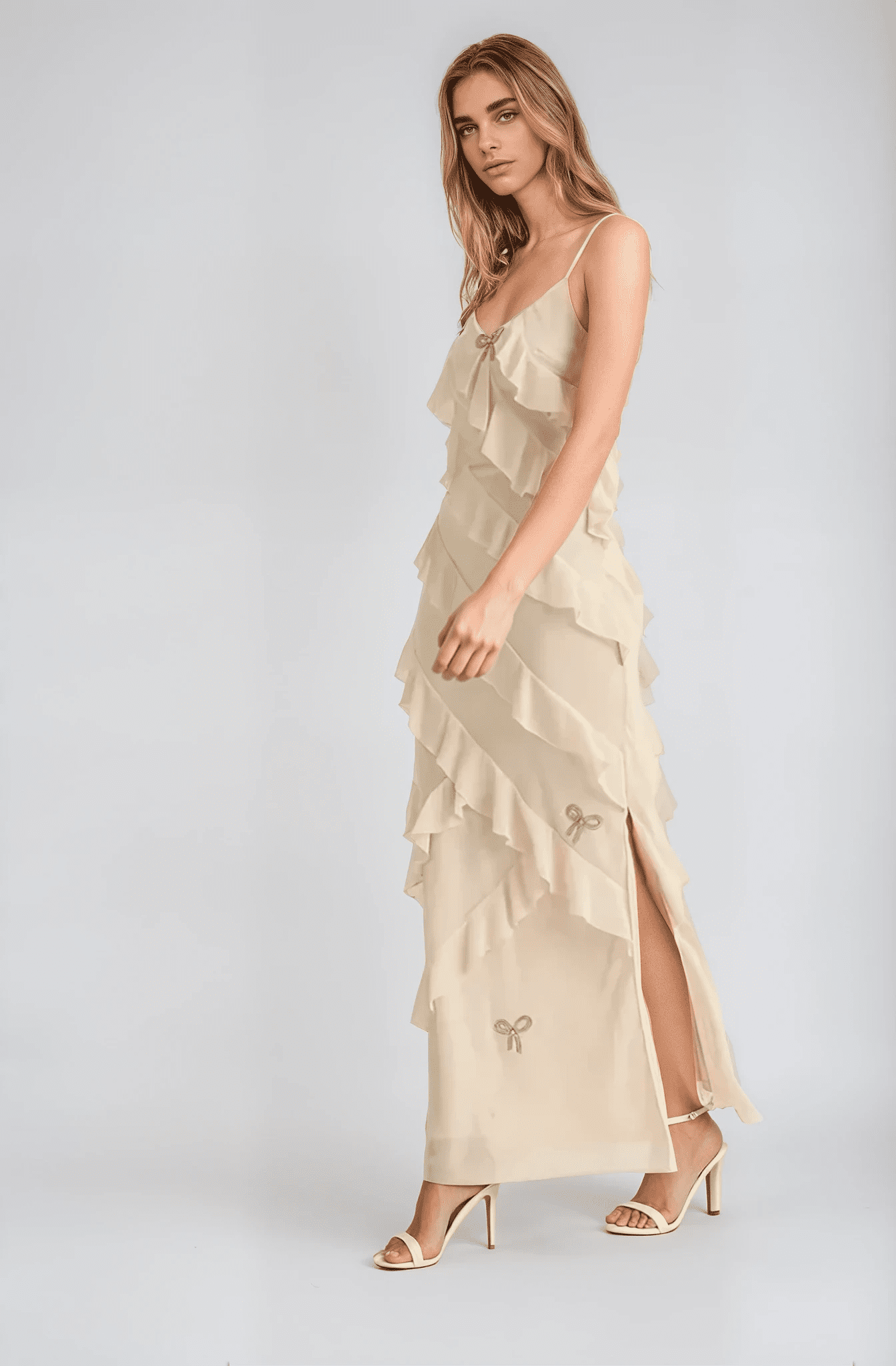 Elegant Elodie dress featuring cascading ruffles, a flattering neckline, and a side slit, perfect for weddings and formal occasions.