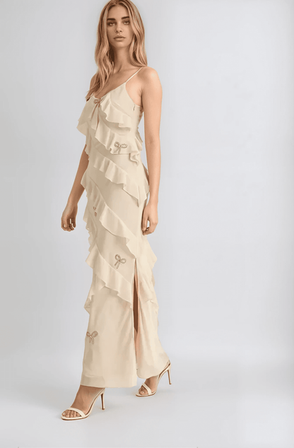 Ethereal Elodie Maxi Dress in creamy champagne with delicate ruffles and side slit, ideal for weddings and formal events.