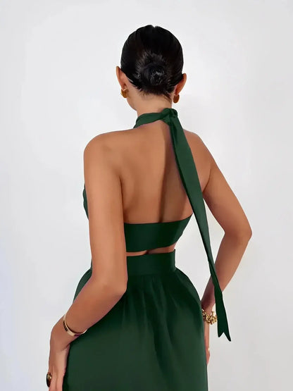 Emerald Muse Set by Lauven featuring a twisted halter crop top in deep green from the back view.
