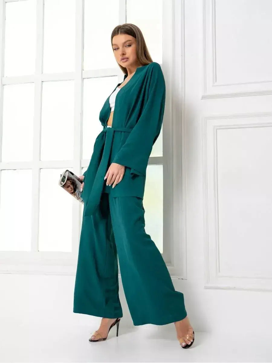 Emerald Suit Set by Lauven featuring a stylish model wearing a luxurious green oversized two-piece set.