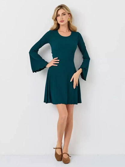 Emerald Whisper mini dress by Lauven, featuring a flattering A-line silhouette in rich emerald green.