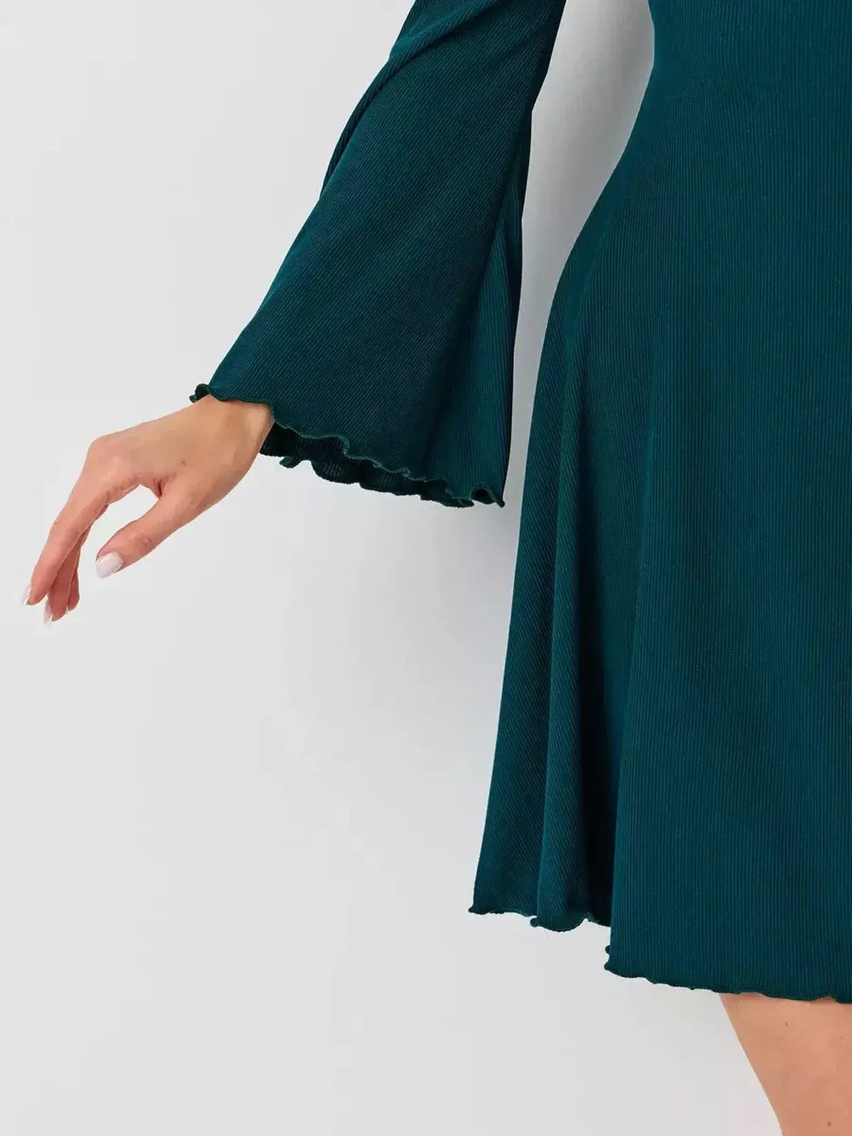 Emerald Whisper mini dress by Lauven featuring a flared hem and stylish bell sleeves in rich emerald green.