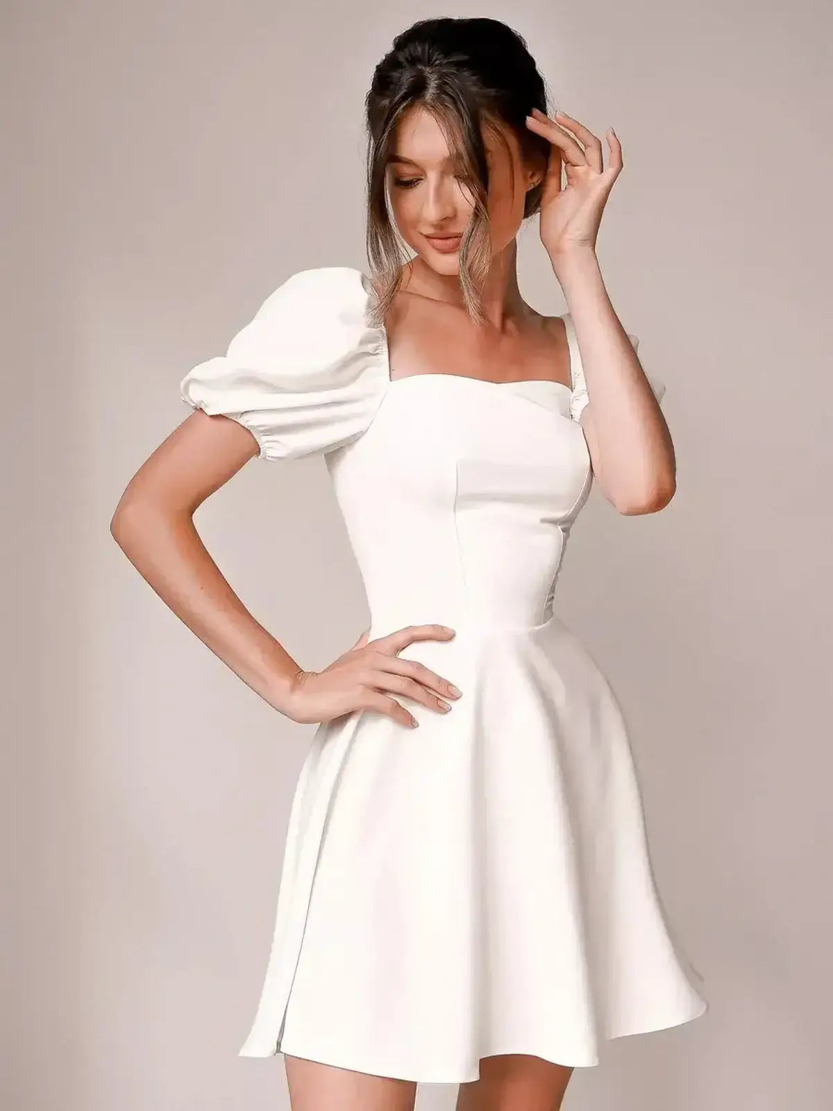 Ethereal Belle white mini dress with puff sleeves and square neckline, perfect for wedding guests or summer parties.