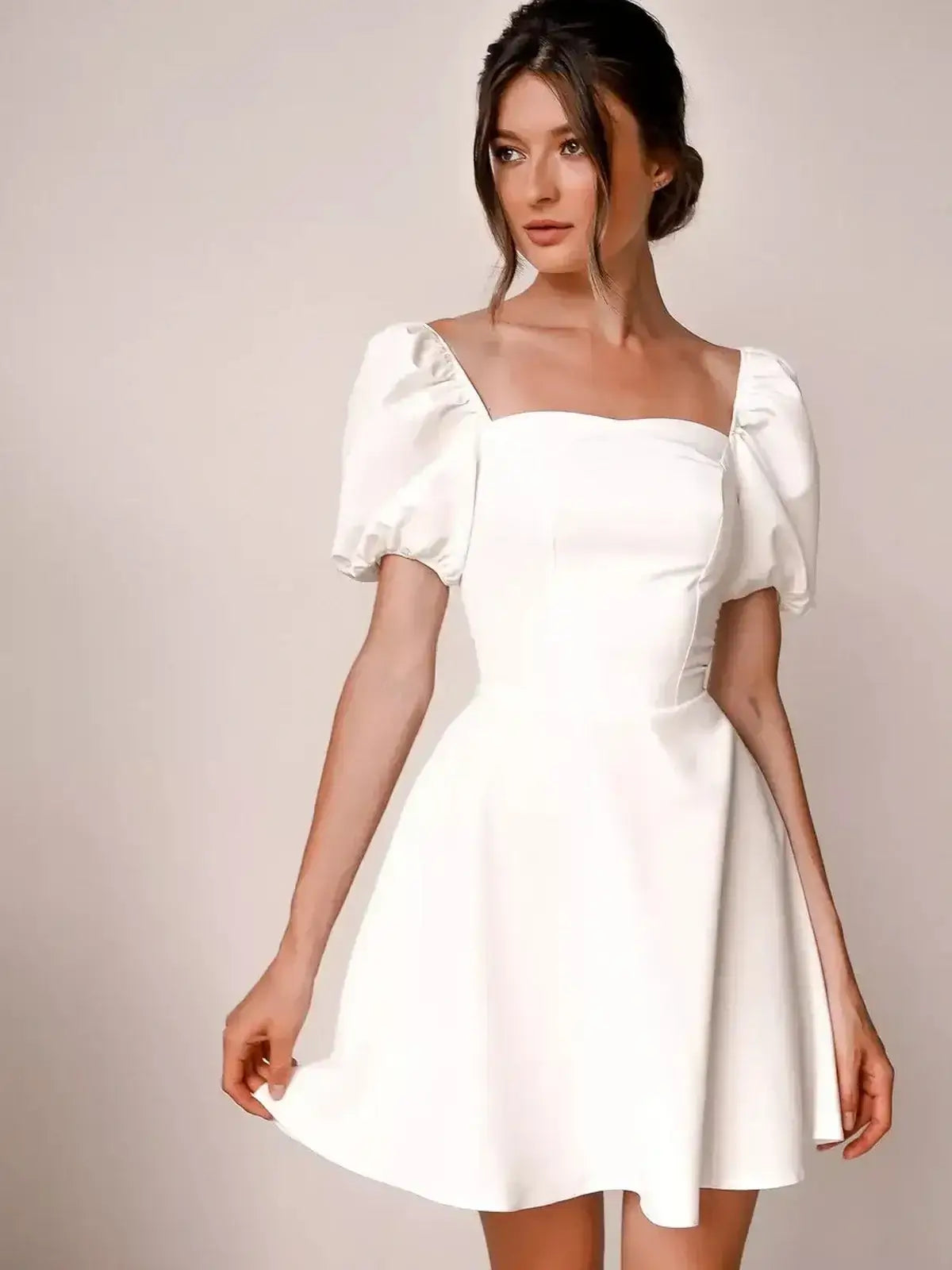 Ethereal Belle white mini dress with puff sleeves and square neckline, perfect for weddings and summer events.