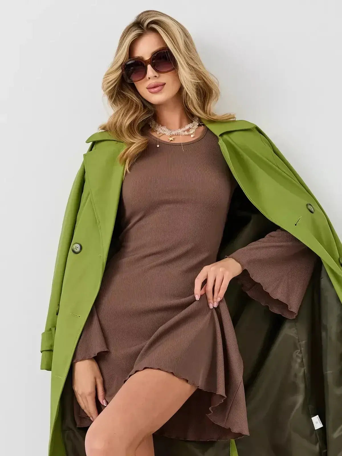 Flare Hour Mini by Lauven, featuring a soft ribbed knit, flared hem, and dramatic bell sleeves in a stylish outfit.