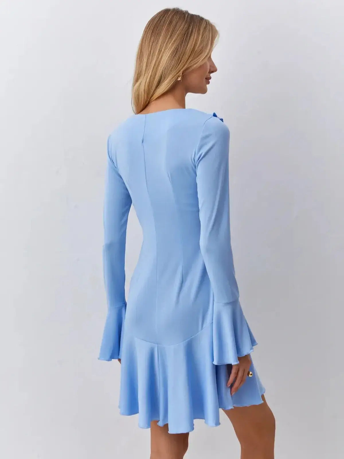 Light blue mini dress with flared hem and long sleeves, perfect for summer events and weddings.