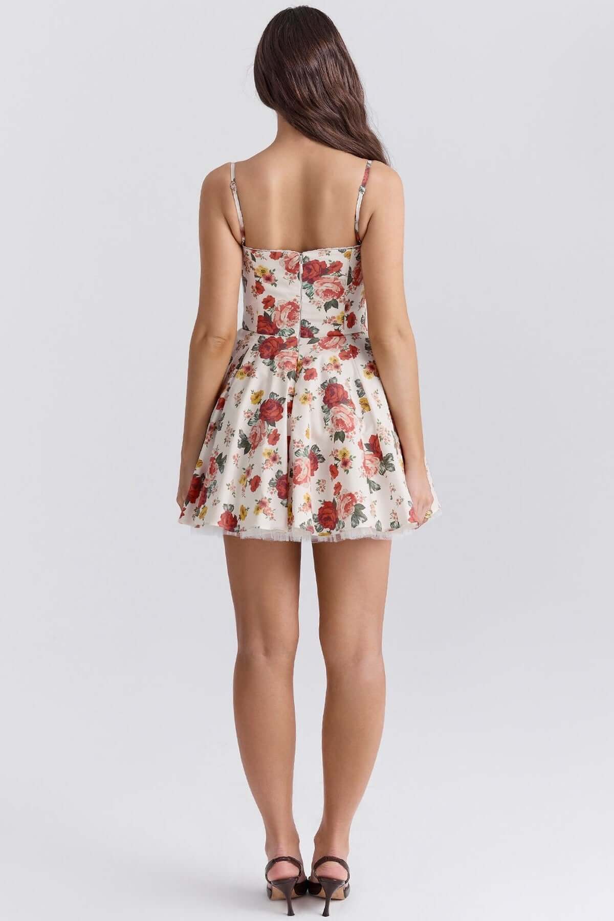 Back view of a floral Garden Muse Mini Dress with a voluminous skirt, perfect for summer weddings and parties.