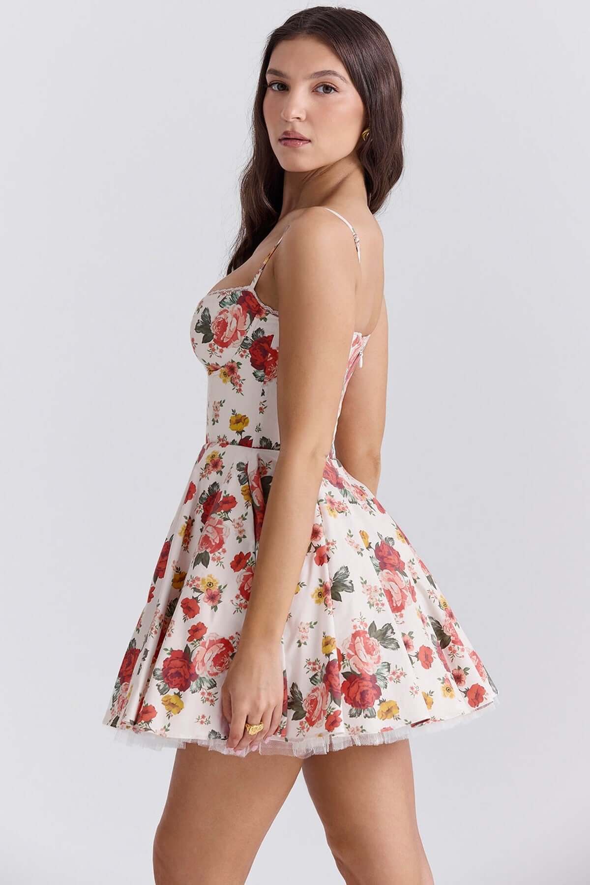 Model wearing the Garden Muse Mini Dress, a floral summer dress with a voluminous skirt and sweetheart neckline.