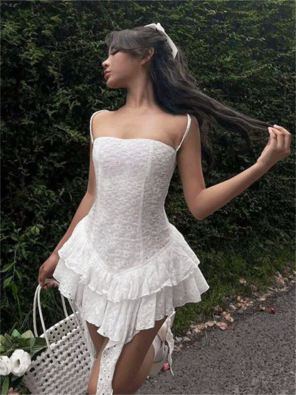 Grace Mini Dress in white with lace detail, perfect for summer parties and special occasions.