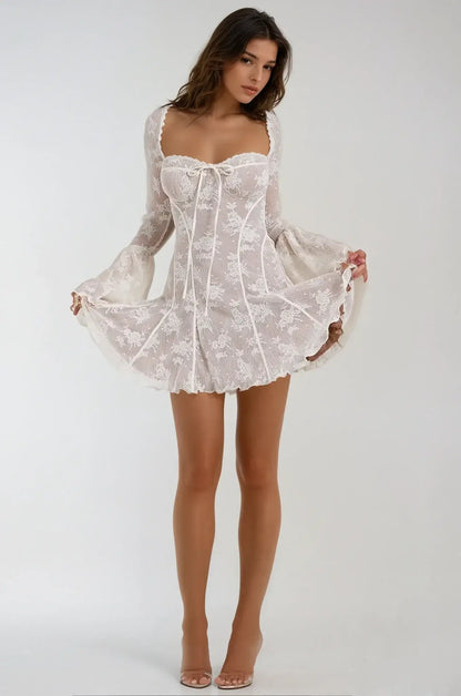 White mini dress with lace overlay and flare sleeves, ideal for summer weddings, parties, and special occasions.