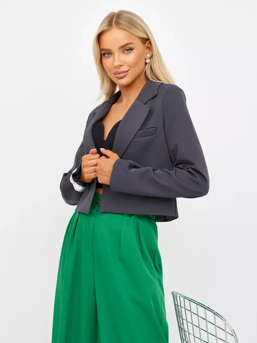 Graphite Blazer by Lauven, women's cropped tailored classic blazer in dark gray, styled with green trousers.