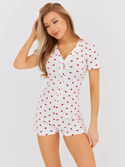 Heartprint V-Neck Romper for Women in white with red heart pattern, featuring a button front and relaxed fit.