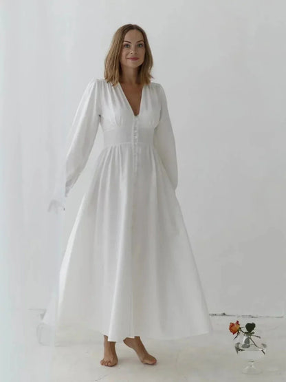 Heirloom Maxi Dress in white cotton, featuring vintage-inspired design with button-down front and long sleeves.
