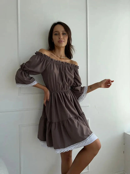 Model showcasing the Mocha Muse off-shoulder mini dress with ruffle trim, perfect for summer elegance and charm.