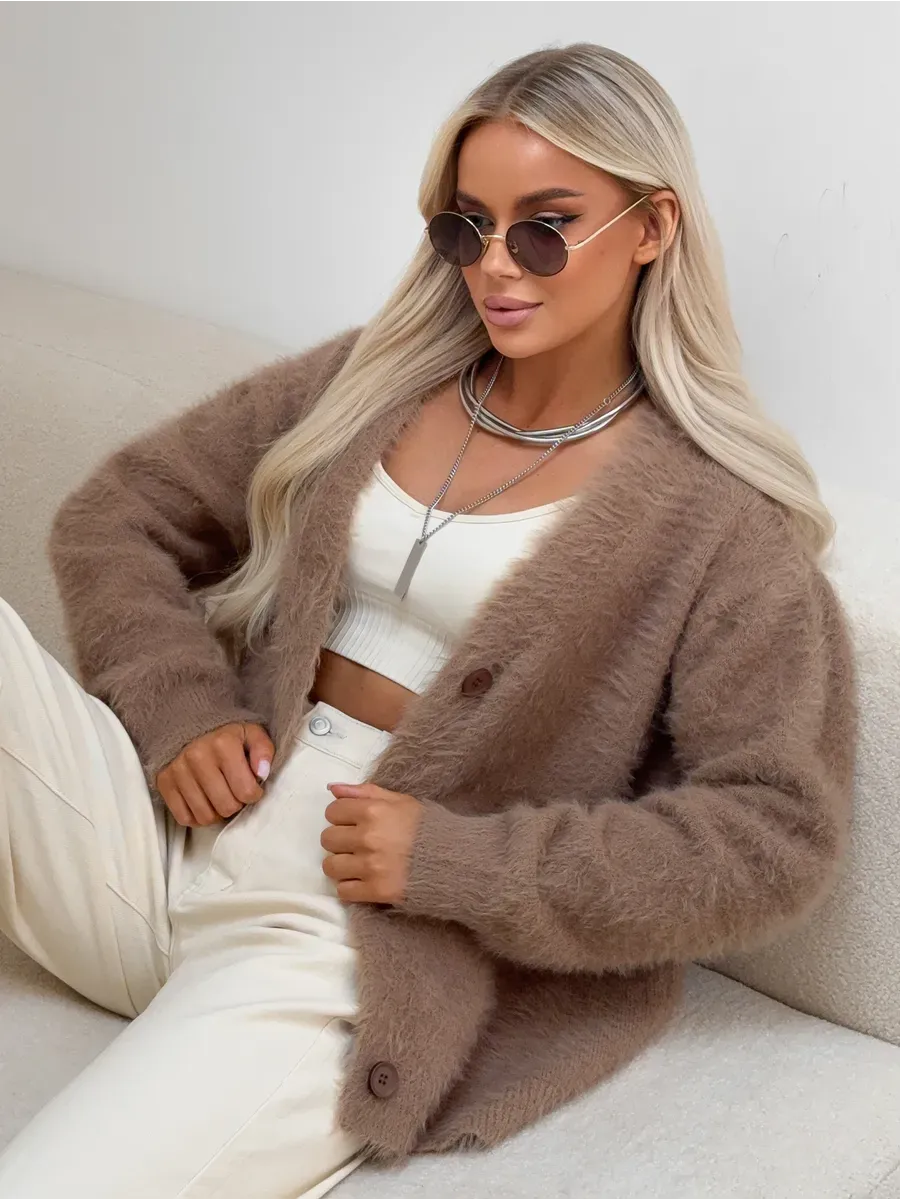 Woman wearing Marlo Cardigan by Lauven, an oversized brown fluffy knit cardigan with button closure.