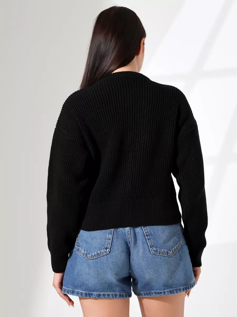 Back view of a woman wearing the Nova Cardigan by Lauven, showcasing its sleek black knit design.