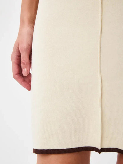 Close-up of Marbella Mini Dress by Lauven featuring soft knit fabric and contrast trim for refined elegance.