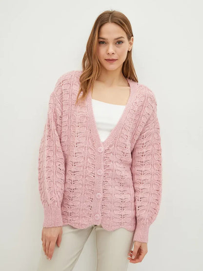 Liora Cardigan by Lauven in soft pink, featuring delicate jacquard knit and a flattering V-neckline for effortless style.