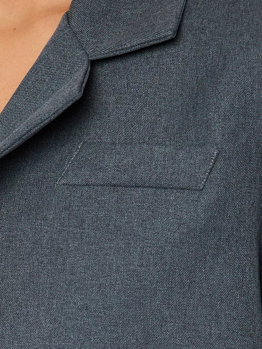 Close-up of the collar and pocket details of the Athena Blazer by Lauven, a women's grey cropped oversized jacket.