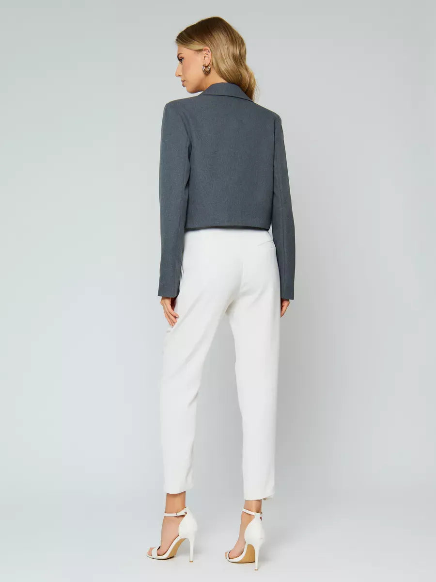 Athena Blazer by Lauven, women's grey cropped oversized jacket styled with white pants from the back.