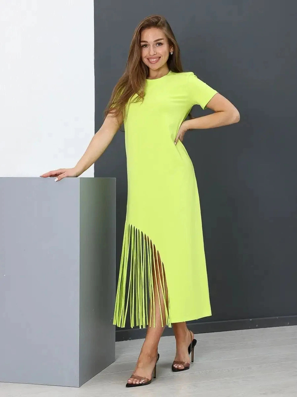 Luma Midi Dress by Lauven in lime cotton with fringe hem, showcasing a relaxed fit and vibrant color.