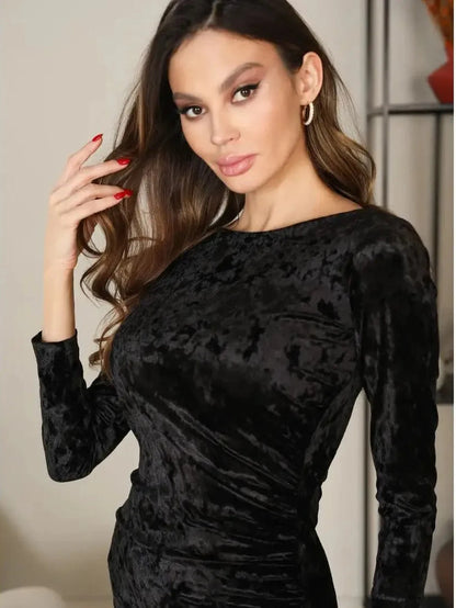 Astra Mini Dress by Lauven showcasing a model in plush black velvet with a sculpted silhouette and elegant neckline.