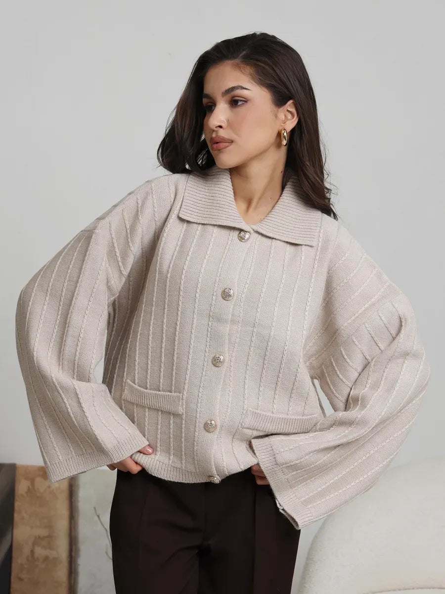 Dune Cardigan by Lauven - Soft light beige oversized knitwear with braided pattern and wide bell sleeves.