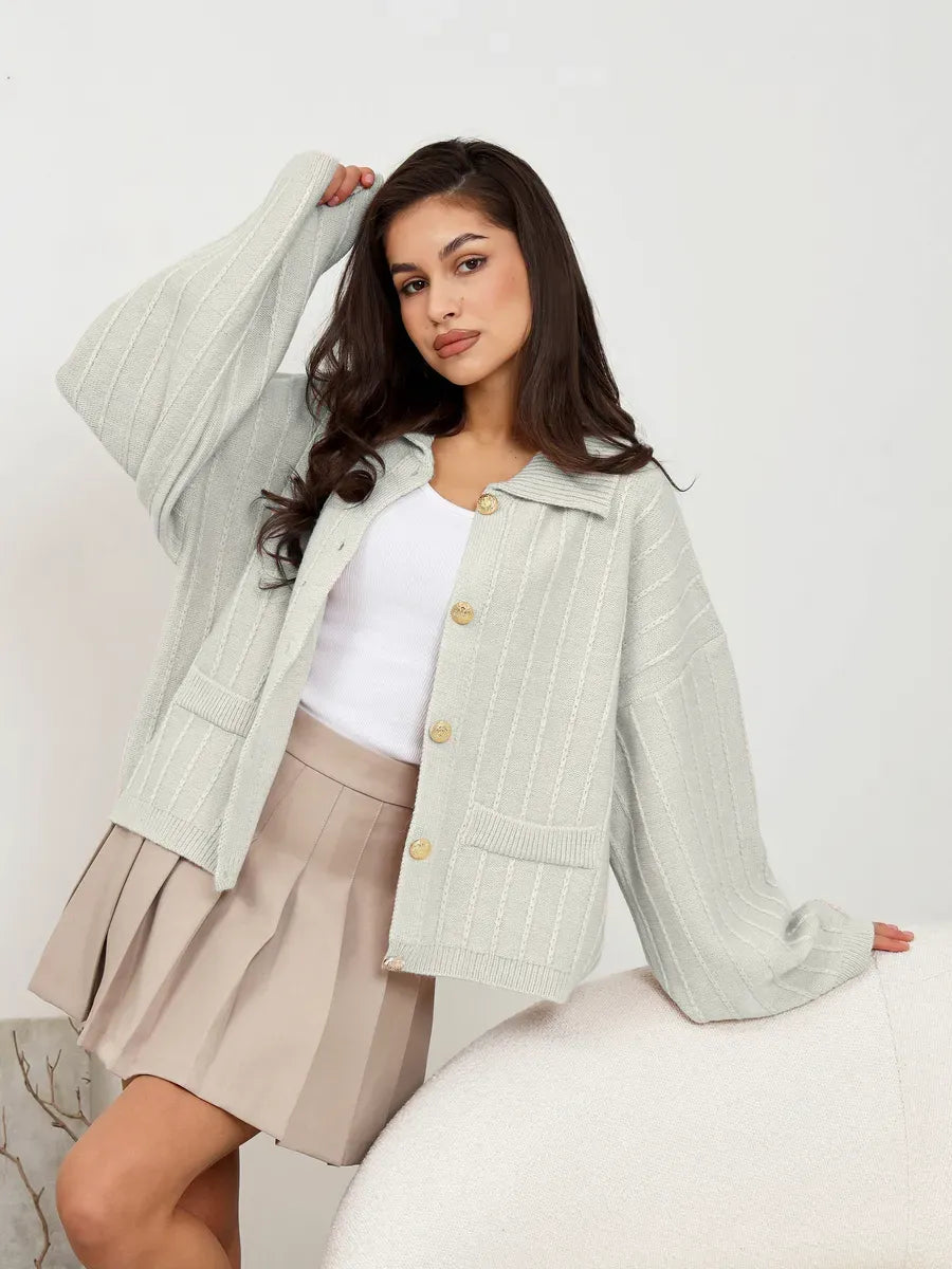 Glacier Cardigan by Lauven in light gray, featuring oversized silhouette and braided detail, perfect for stylish spring layering.