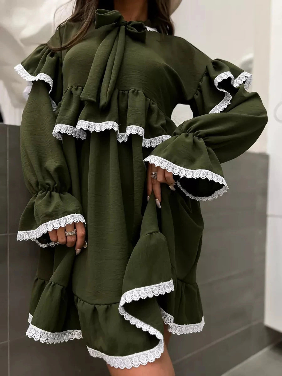 Olivea Mini Dress from Lauven featuring romantic ruffles and lace trim, perfect for chic and comfortable style.