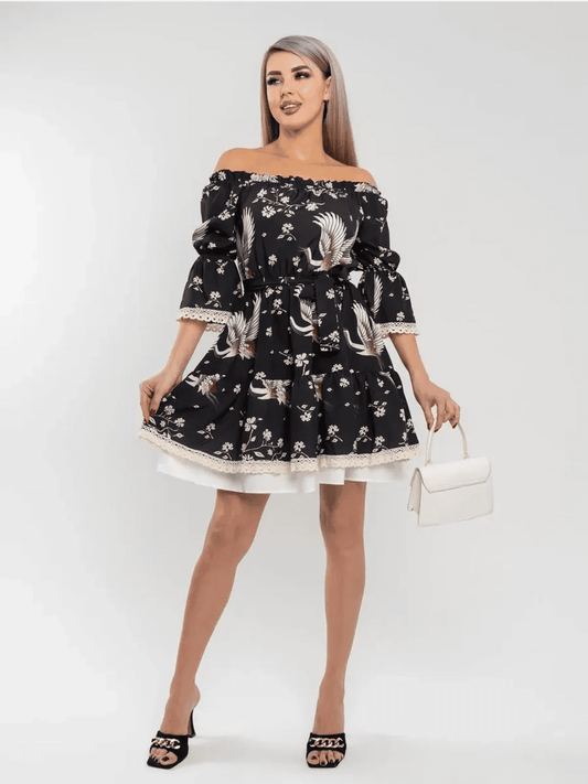 Off-shoulder Crane Bloom mini dress featuring tiered skirt and floral print, perfect for stylish, romantic occasions.