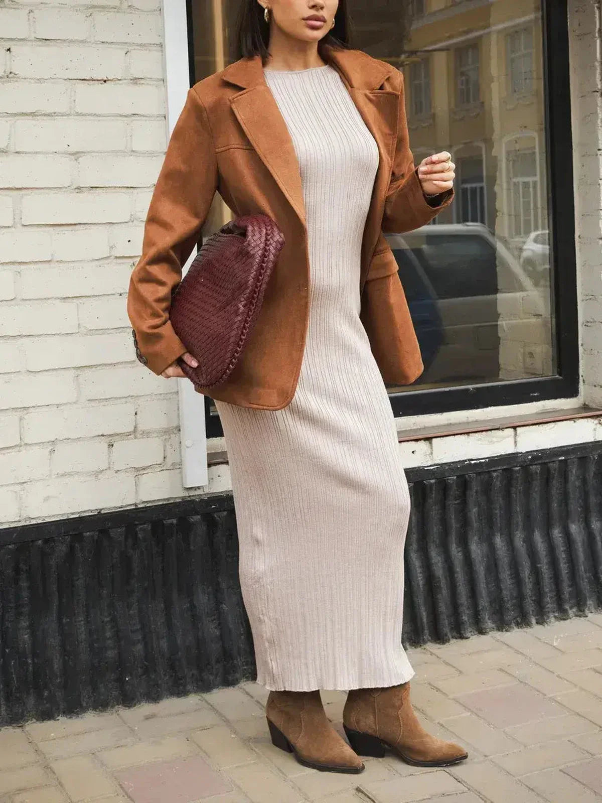 Model wearing a Contour Knit Maxi Dress with a stylish blazer, showcasing a sophisticated and elegant look.